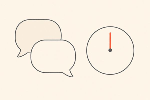 Dois balões de conversa separados por um espaço de um relógio sem ponteiros.